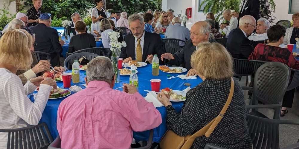 A communal meal following the Torah Services is a beautiful continuation of the spiritual gathering